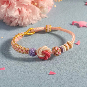 Geflochtenes Armband mit Pfirsichblütenknoten