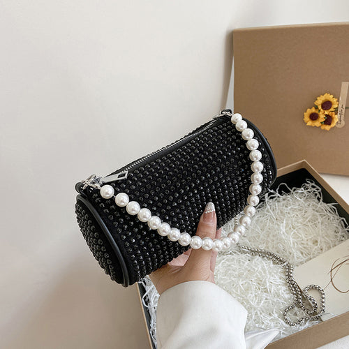 Glänzende kleine Zylindertasche