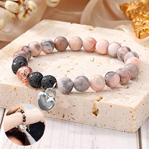 Rosafarbenes Armband mit herzförmigem Anhänger