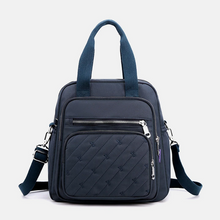 Laden Sie das Bild in den Galerie-Viewer, Multifunktionaler, leichter, eleganter Handtaschen-Umhängetaschen-Rucksack mit Prägung