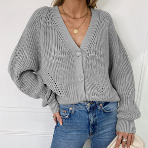 Einfarbiger Strickpullover mit Ballonärmeln und V-Ausschnitt
