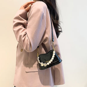 Stilvolle vielseitige Handtasche mit Perlen