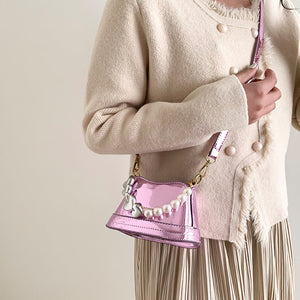 Stilvolle vielseitige Handtasche mit Perlen