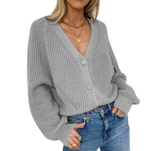 Einfarbiger Strickpullover mit Ballonärmeln und V-Ausschnitt